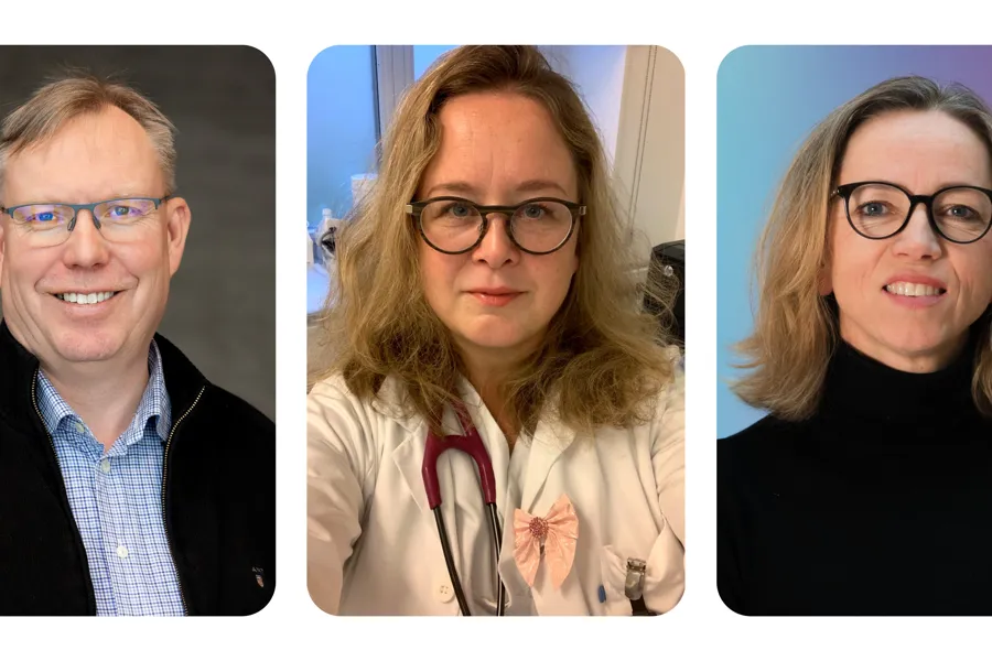 En gruppe mennesker som smiler