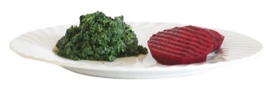 Et stykke kjøtt og et stykke brokkoli på en tallerken