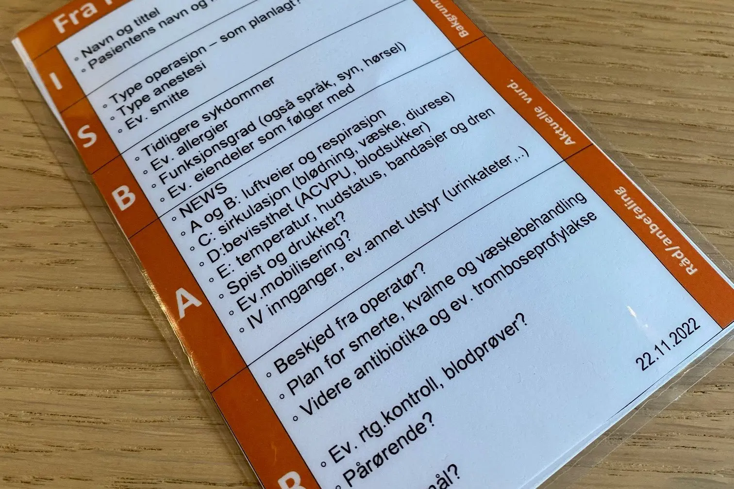 Laminert lommekort med spørsmål