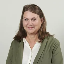 A person in a green suit