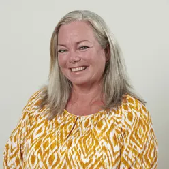 A woman smiling for the camera